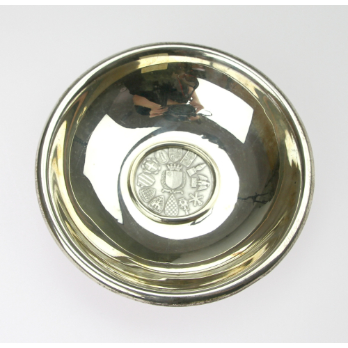 Silver bowl with coin