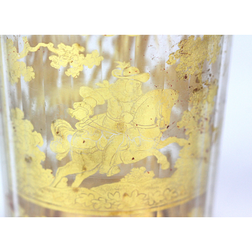 Double walled glass with a gold foil