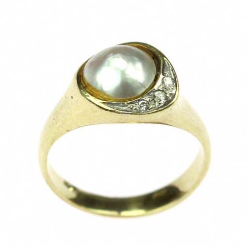 Gold ring with half a pearl...