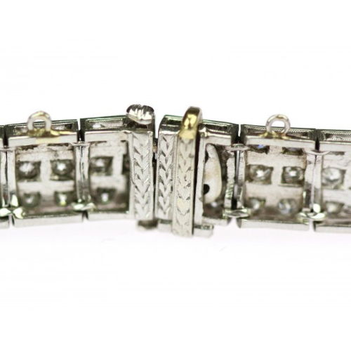 Platinum bracelet decorated with diamonds, emeralds and rubies
