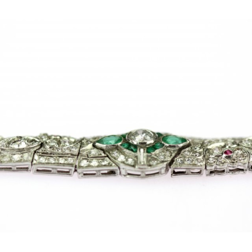 Platinum bracelet decorated with diamonds, emeralds and rubies