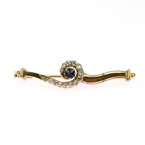Gold brooch with sapphire...