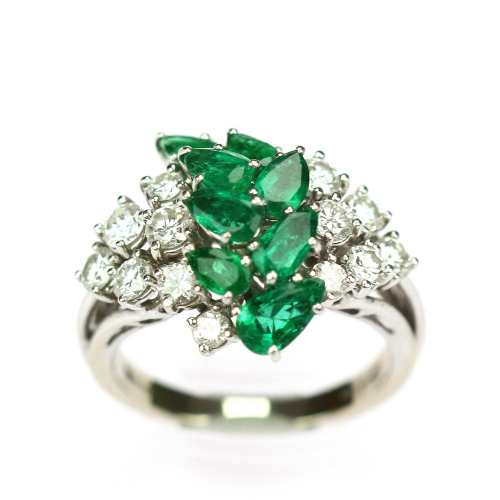 Gold ring with emeralds and...