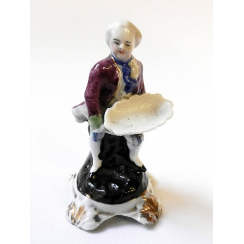 Porcelánová figurka - muž s nádobou