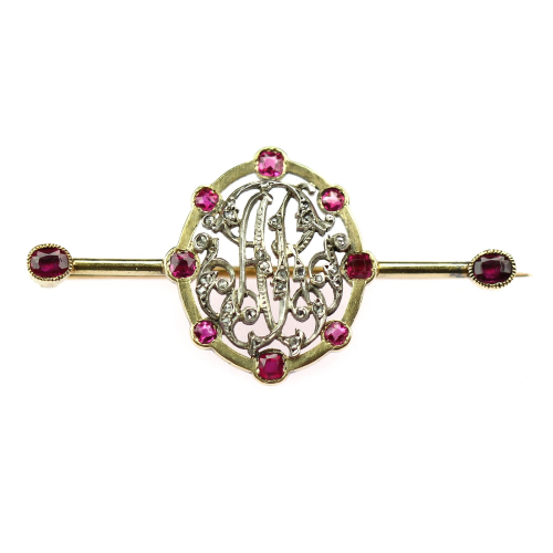 Gold brooch with monogram