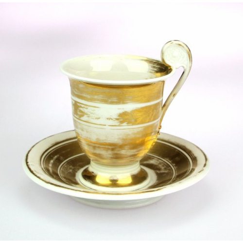 Gold coated cup with saucer