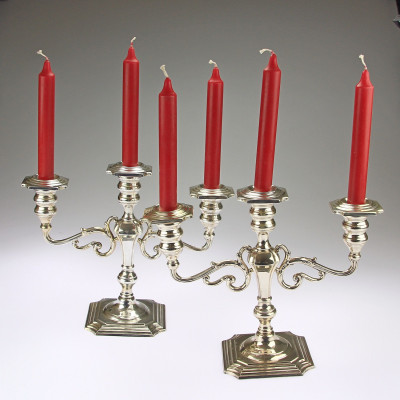A pair of three-branched silver candelabra