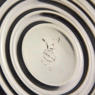 A pair of three-branched silver candelabra