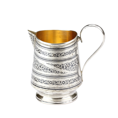 Silver milk jug decorated with tula