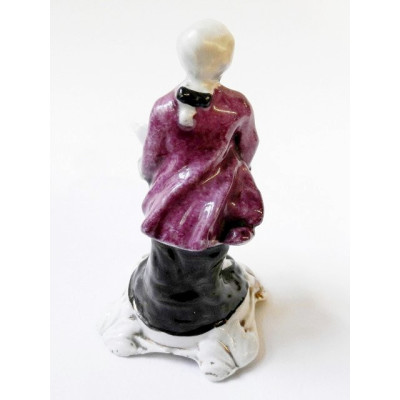 Porcelain figurine - man with vessel