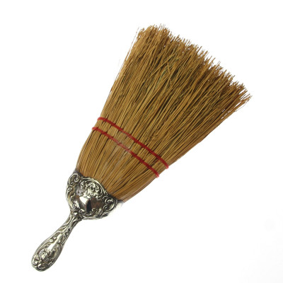 Hand broom with silver handle