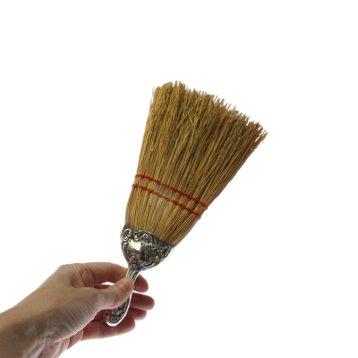 Hand broom with silver handle