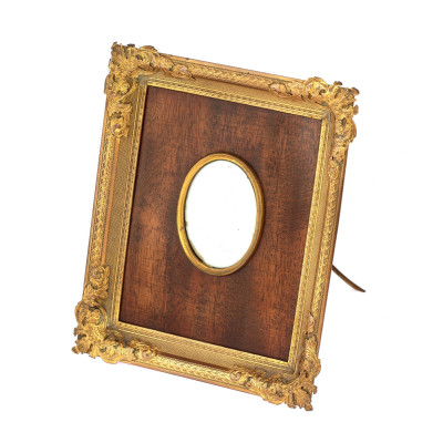 Wooden frame with brass decoration
