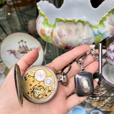 Silver pocket watch and chain with locket