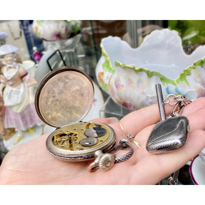 Silver pocket watch and chain with locket