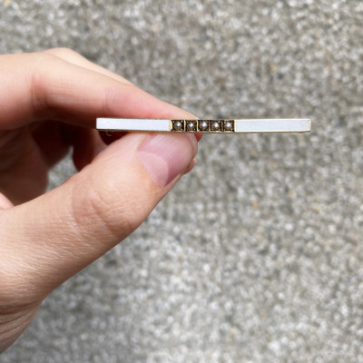 Gold bar brooch with enamel and seed pearls