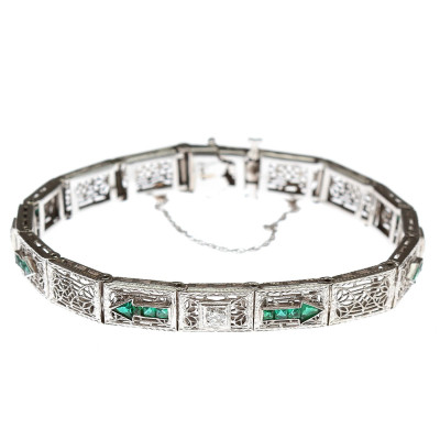 Zlatý náramek s diamanty a imitací smaragdů