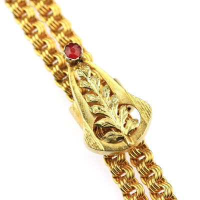 Dlouhý zlatý řetěz se secesním jezdcem