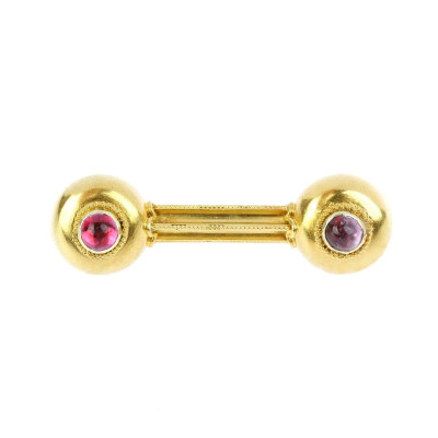 Gold brooch with cabochon cut amethysts