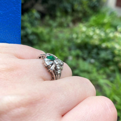 Silver ring with diamonds and emerald