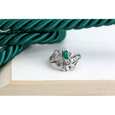 Silver ring with diamonds and emerald