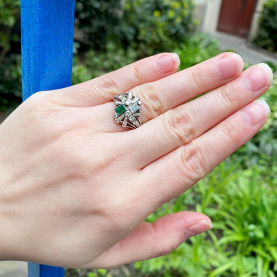 Silver ring with diamonds and emerald