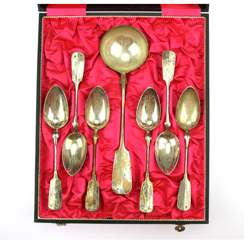 Set of silver spoons and ladle